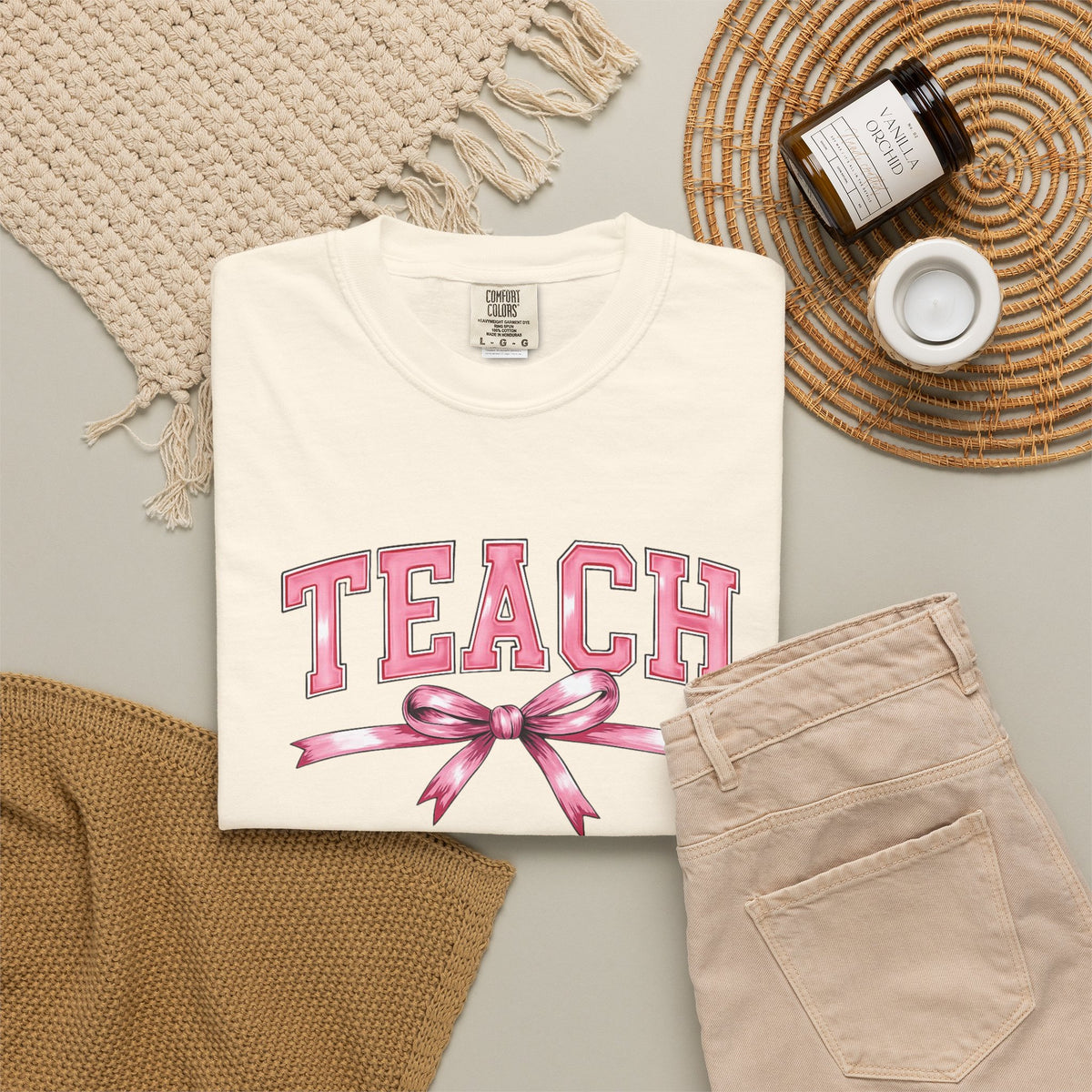 Teach graphic T-shirt | Pink ribbon collegiate letters