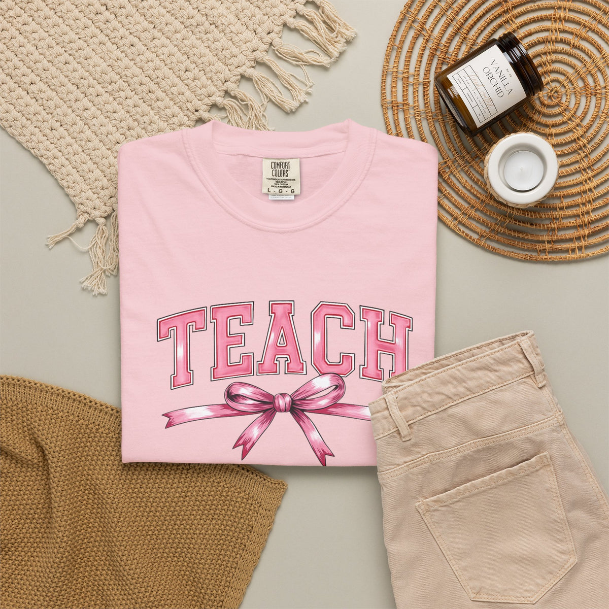 Teach graphic T-shirt | Pink ribbon collegiate letters