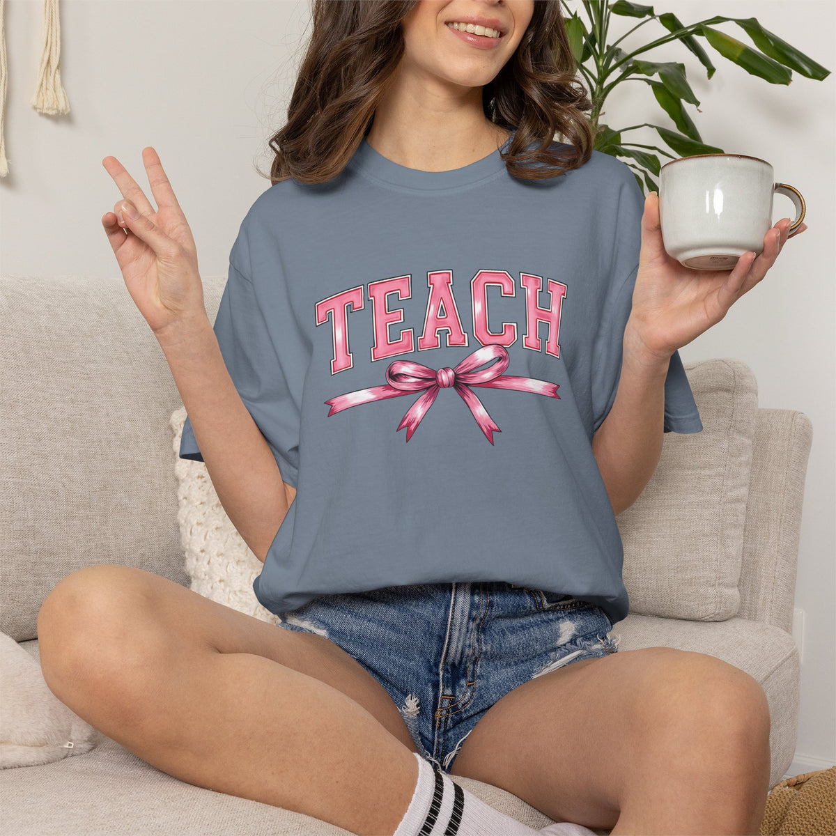 Teach graphic T-shirt | Pink ribbon collegiate letters