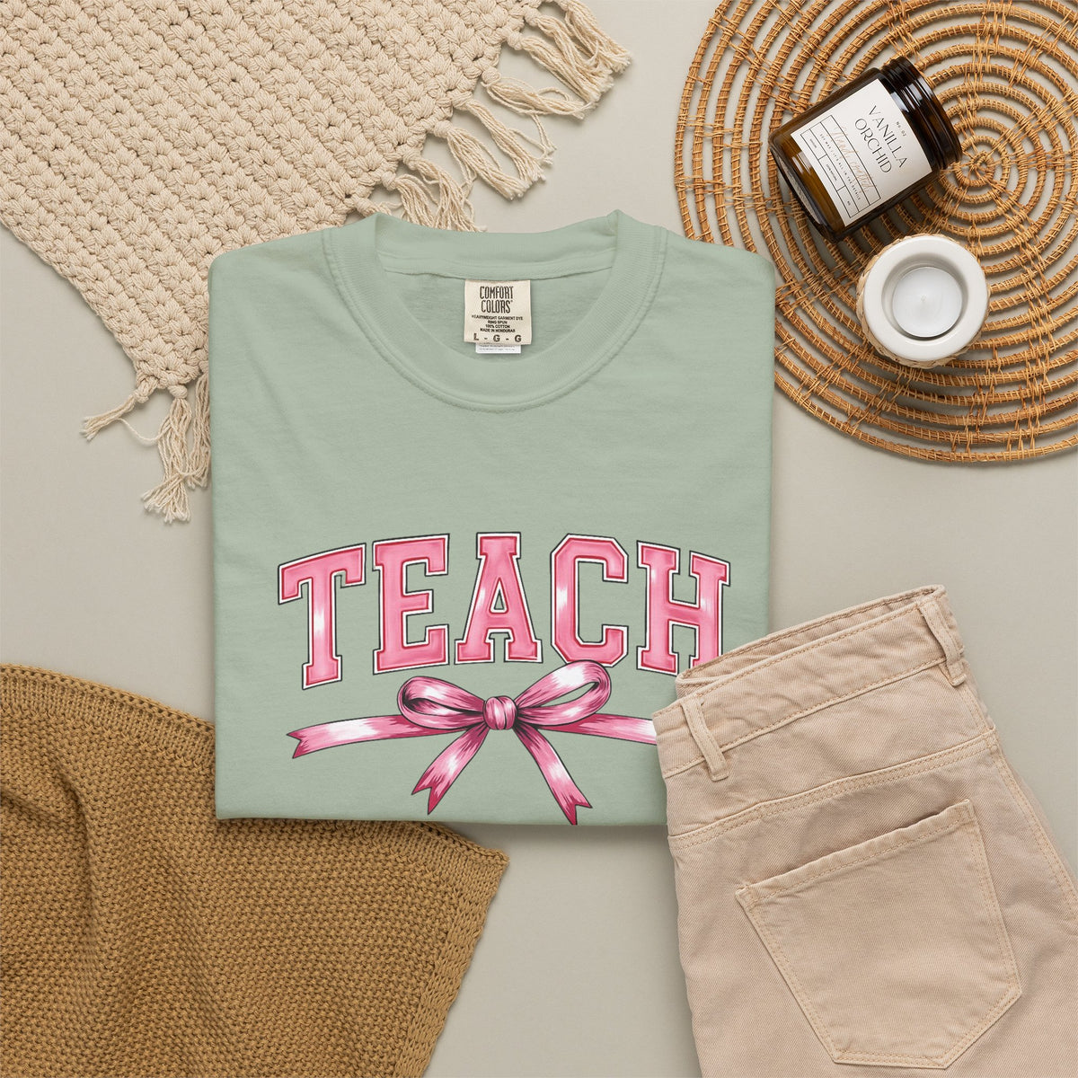 Teach graphic T-shirt | Pink ribbon collegiate letters